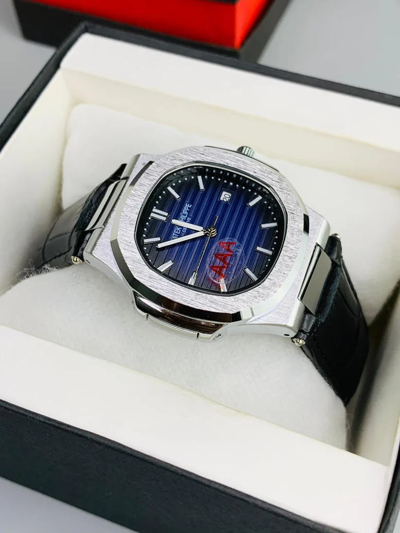Luxury watch with black strap and blue face in a box